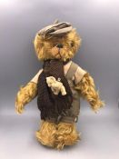 Mohair Bear with flat cap and small teddy bear on scarf. B logo on ear. 10 inches.