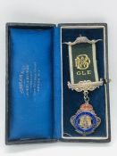 A hallmarked Masonic medal in original box, Lodge No 4557.