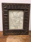 A Pencil drawing of two angels in a carved frame