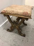 A Gilt scrolled cross banded stool