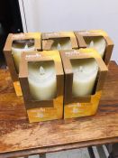 Five MovinFlame led candles with wax outer layer and real flame effect.