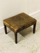 Small distressed green leather fireside stool with brass stud trim