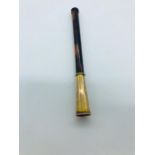 A cigarette holder with a 9ct gold mount.