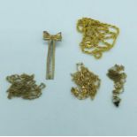 A selection of 9ct gold jewellery to include four chains and a bow brooch (7.8g)