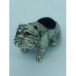 A sterling silver pincushion in the form of a dog