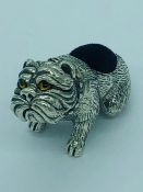 A sterling silver pincushion in the form of a dog