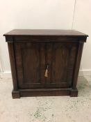 Mahogany side cabinet with two doors, flanked by columns