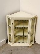 Cream painted wall corner cabinet with two shelves and glass door