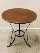 A round metal bistro table with copper coloured top (Diam 67cm)