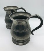 A pair of large Victorian Baluster pewter tankards