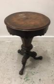 A Walnut work table of Octagonal form, the hinged top revealing a fitted interior