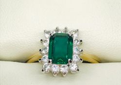 A Fashion ring with green central stone