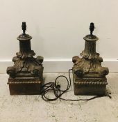 A pair of 19th Century cast iron lamps. (One AF)