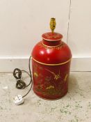 A red metal painted lamp base.