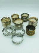 A selection of white metal napkin rings.