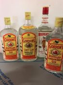 Two bottles of 1/2 L Gordons, 1L and 1L Beefeater Gin