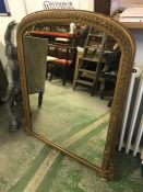 A Late 19th Century over mantle mirror with some foxing.