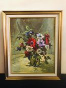 A framed oil on canvas of flowers in jar by Sally Ann Putman