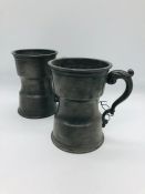 A pair of old English pewter tankards made in London.