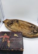 A Large carved oak oval tray with floral motif and other treen items.