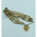 A 9ct yellow gold gate bracelet with a heart shaped fastener.(10.5g)