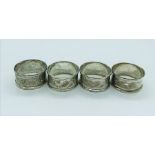 A set of four hallmarked silver napkin rings