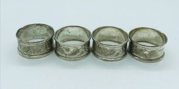A set of four hallmarked silver napkin rings