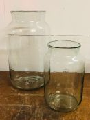 Two large glass jars by Mica decorations standing 43cm H and 30cm H