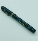 A Fountain pen with gold nib.