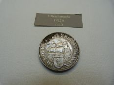 A silver German 1927 5 Reichsmark coin, AEF, 25g, Eagle on Shield with Sailing Ship to reverse.