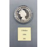 A Turks And Caicos Islands 20 Crowns silver proof coin.