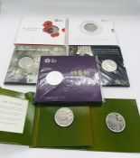 A selection of Royal Mint £5 uncirculated coin sets to include: The Longest Reigning Monarch 2015,