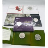 A selection of Royal Mint £5 uncirculated coin sets to include: The Longest Reigning Monarch 2015,