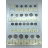 A range of fifty two different coins from Kuwait, across various years, denominations and