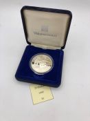 A 1992 Twenty Five dollar silver proof coin celebrating the XXV Olympic Games