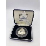 A 1998 Bermuda silver proof Triangular $3 coin.