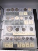 An album of Austrian coins from the 1600's onwards, catalogued and labelled.