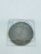 An 1804 George III Bank of England silver dollar.