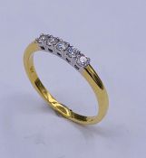 An 18ct yellow gold five stone diamond ring of 25 points approx