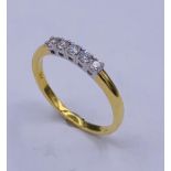 An 18ct yellow gold five stone diamond ring of 25 points approx