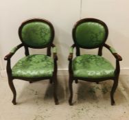 Pair of regency style balloon back arm chairs with green upholstery