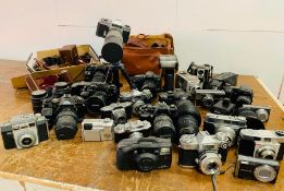 A Large volume of Cameras and cases.