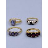 A selection of four 9ct gold rings with various settings.(11.9g)