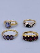 A selection of four 9ct gold rings with various settings.(11.9g)