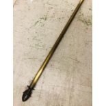 A Brass curtain pole with pine cone finials 280cm long inc finials.