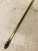 A Brass curtain pole with pine cone finials 280cm long inc finials.
