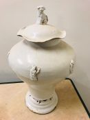 A white lidded Chinese vase, lid with Foo dog finial.