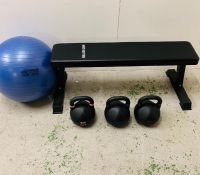 A Bulldog Gear bench and kettle drum set, along with an exercise ball.