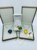 Three boxed items of contemporary glass jewellery, to include two Murano glass heart pendants and an