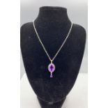 A silver CZ and amethyst drop pendant necklace on silver chain